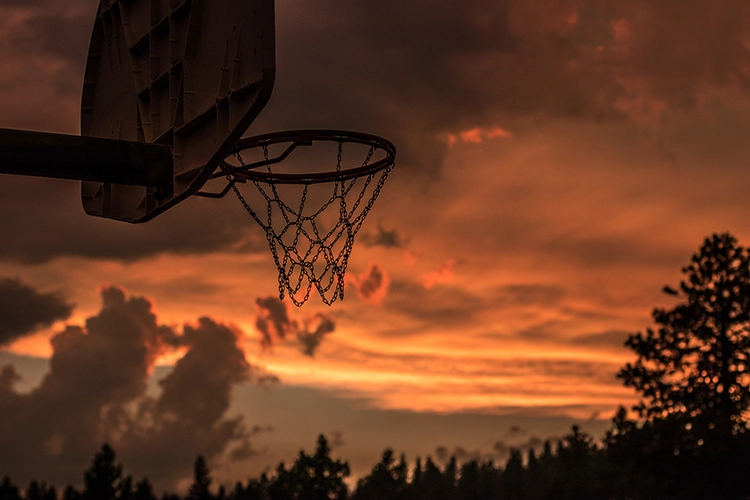 sunset and basketball hoop